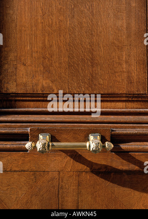 Carved wood and brass handle Stock Photo