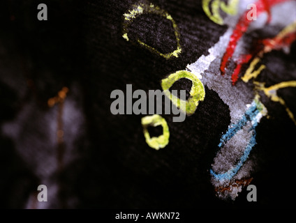 Painting, bright colors on black surface, close-up Stock Photo