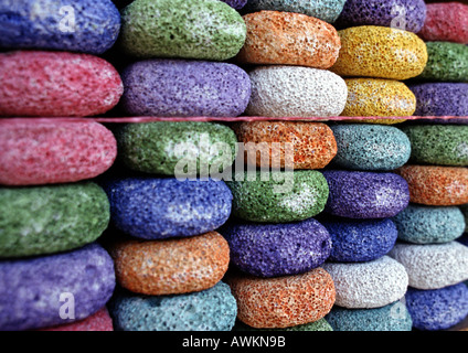 Stacks of round multi-colored pumice stones in rows Stock Photo