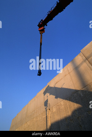 Crane and shadow on wall, low angle view Stock Photo