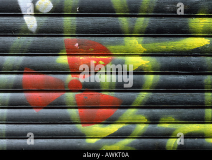 Radioactive warning symbol on roller shutter, close-up Stock Photo