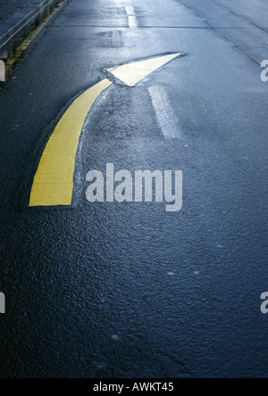 Directional arrow on road, close-up Stock Photo