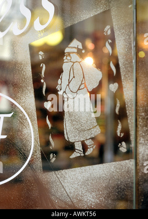 Santa Claus figure stenciled on window, close-up Stock Photo