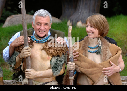 OWNER OF WOOKEY HOLE CAVES GERRY COTTLE NEAR WELLS SOMERSET UK PICTURED WITH HIS PERSONAL ASSISTANT LOUISE PRIOR POSING AS CAVEM Stock Photo