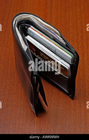 Money and credit cards in wallet Stock Photo - Alamy