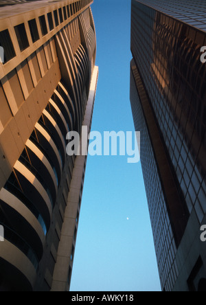 A low angle shot of two skyscrapers with dark cloudy sky Stock Photo ...