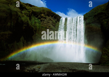 Rainbow over Skogafoss Waterfall, Iceland, Atlantic Ocean Stock Photo