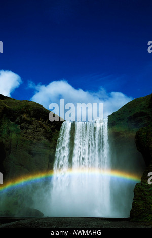 Rainbow over Skogafoss Waterfall, Iceland, Atlantic Ocean Stock Photo