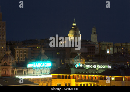 Buildings in city lit up at night, Genoa, Liguria, Italy Stock Photo