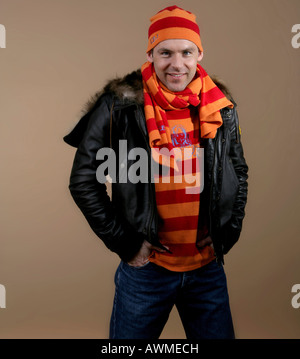 Young man wearing a wool cap and scarf Stock Photo