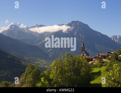 The pretty village of Rieg with Church spire below Riederfurka high in the Swiss Alps Canton of Valais Switzerland Stock Photo