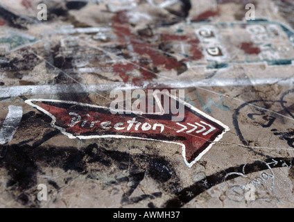 Graffiti with "direction" text written inside arrow, close-up Stock Photo