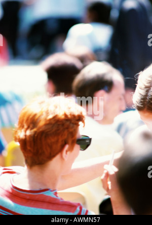 Group of people, outside, rear view, blurred, close-up Stock Photo