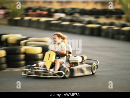 Two people go-carting, blurred motion Stock Photo