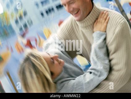 Man and woman holding each other, blurred Stock Photo
