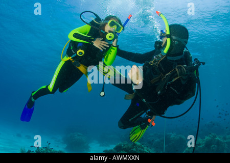 Girl taking scuba lessons in the ocean Indonesia, Asia Stock Photo