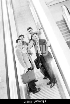 Group of business people waving at camera, blurred, b&w. Stock Photo