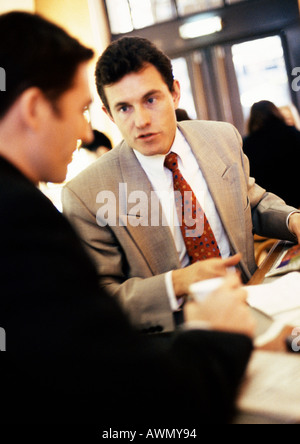 Businessmen talking together, close-up Stock Photo