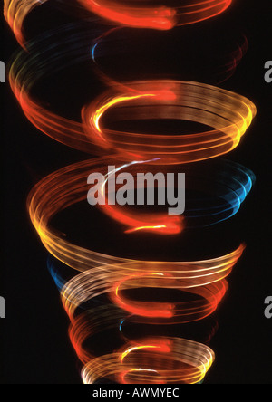 Spiraling light effect, one within the other, oranges, reds and blues. Stock Photo