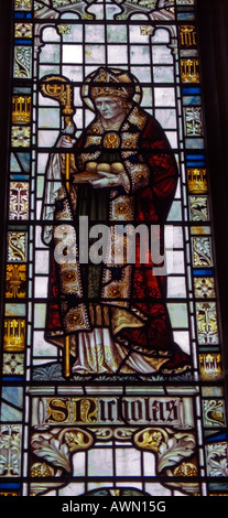 St Nicholas stained glass window St Andrew s Church Alfriston East Sussex England UK Stock Photo