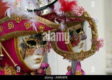 People wearing costumes and masks during Carnival in Venice, Italy, Europe Stock Photo