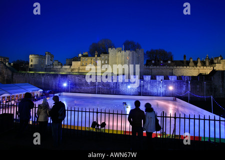 Artificial ice skating rink for Christmas skating in front of the Tower of London, UK Stock Photo
