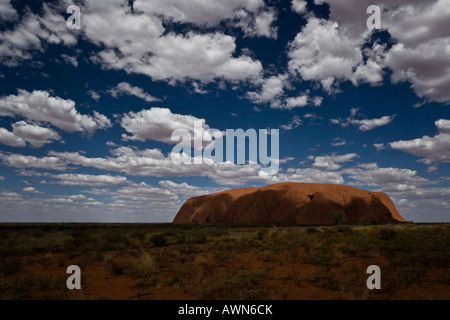 Dramatic light and shadow over the Uluru (Ayres Rock) in the Australian Outback Stock Photo