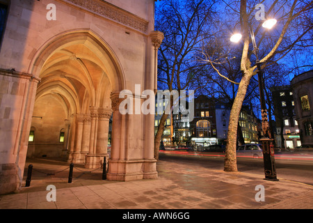 Arcades of the Royal Courts of Justice and Tudor houses on Strand, City of Westminster, London, UK Stock Photo