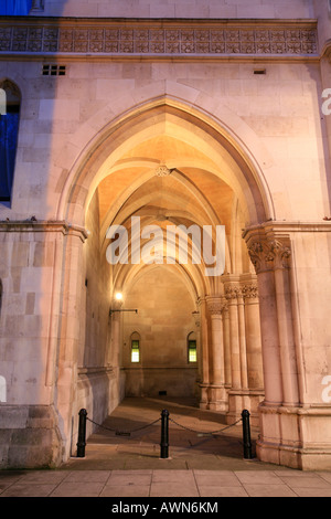 Arcades of the Royal Courts of Justice and Tudor houses on Strand, City of Westminster, London, UK Stock Photo