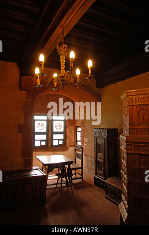 Room with fireplace at the Château du Haut-Knigsbourg fortress, Alsace, France, Europe Stock Photo