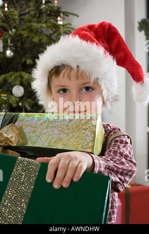 Portrait of a boy holding presents Stock Photo