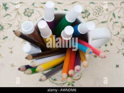 Mug full of colored pencils and markers, high angle view Stock Photo