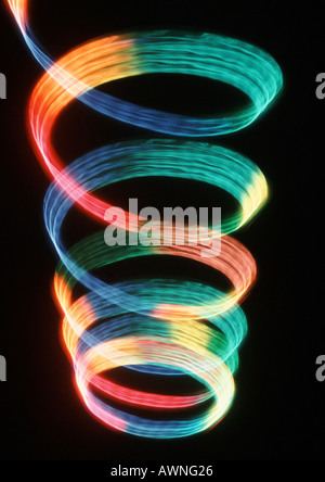 Spiraling light effect, rainbow colors. Stock Photo