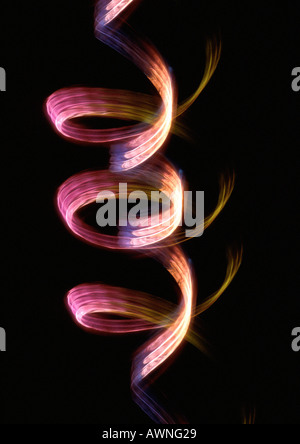 Swirling light effect, pinks and reds. Stock Photo