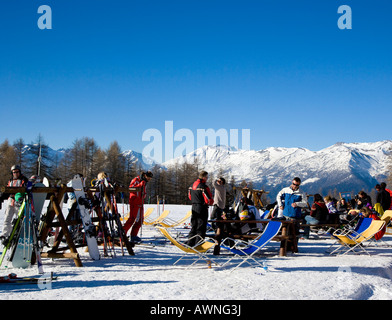 Relaxing in the sun Sportinia Sauze d Oulx Piemonte Italy Stock Photo