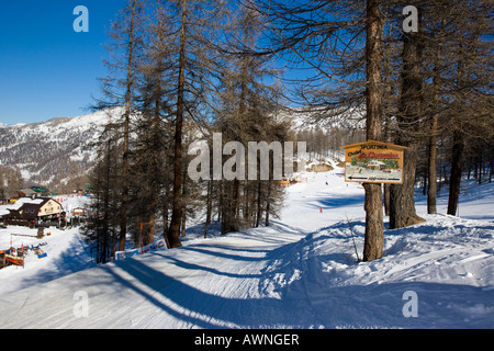 Sportinia and piste sign post Sauze d Oulx Italy Stock Photo