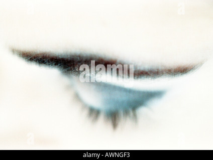 Woman's closed eye with blue eye shadow, close-up, high angle view, blurry. Stock Photo