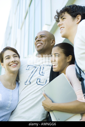 Group of college students standing close together, smiling Stock Photo