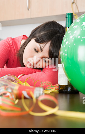 Woman sleeping after a party Stock Photo