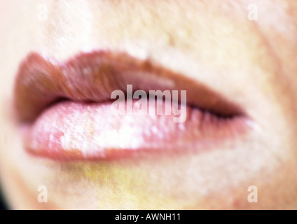 Woman wearing pink lipstick, extreme close up of mouth, blurred. Stock Photo