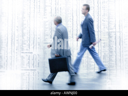 Two men walking on stock quotes, montage Stock Photo