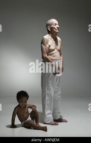 Elderly man and toddler Stock Photo