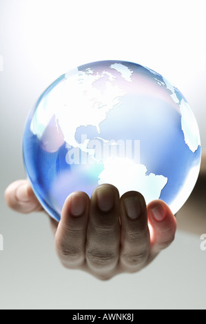 A person holding planet earth Stock Photo