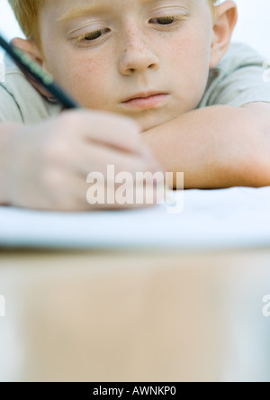 Boy doing homework Stock Photo