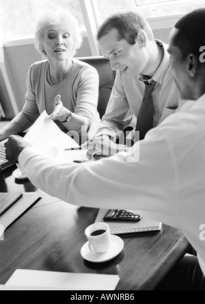Business people examining document, B&W Stock Photo