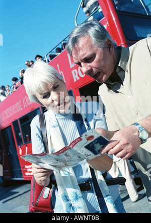 Mature woman and man examining a brochure Stock Photo