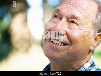 Mature man looking up, close-up, portrait Stock Photo