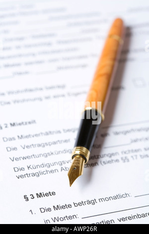 Fountain pen laying on top of a contract Stock Photo