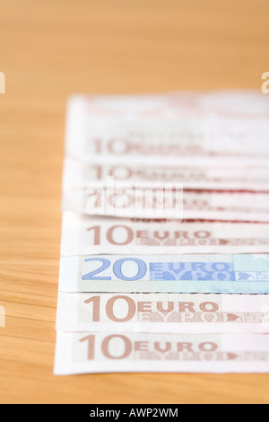 Euro bills laid out in a row Stock Photo