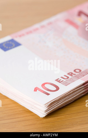Stack of 10-Euro bills on a table Stock Photo